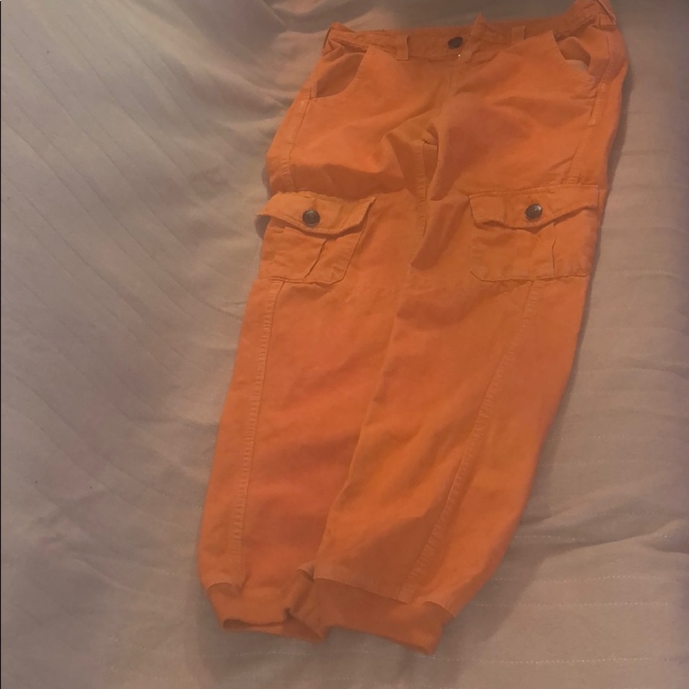 Orange pants true religion with black spot on butt